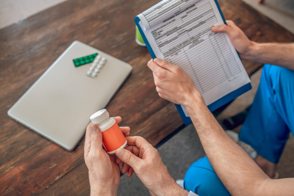 patient and a doctor selecting dietary supplements at the table